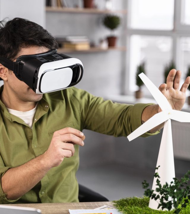man working eco friendly wind power project with virtual reality headset man working eco friendly wind power project with virtual reality headset